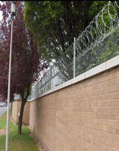 Perimeter wall and electric fence